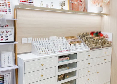 Nail polish selection at The Skin Edit, Singapore, SG, showcasing vibrant color variety and elegant organization.