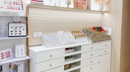 Nail polish selection at The Skin Edit, Singapore, SG, showcasing vibrant color variety and elegant organization.