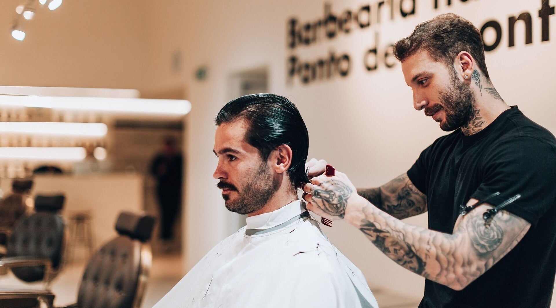 Professional hairstylist trimming hair at Barbieri Barbershop & SPA, Lisboa, Lisboa, PT.