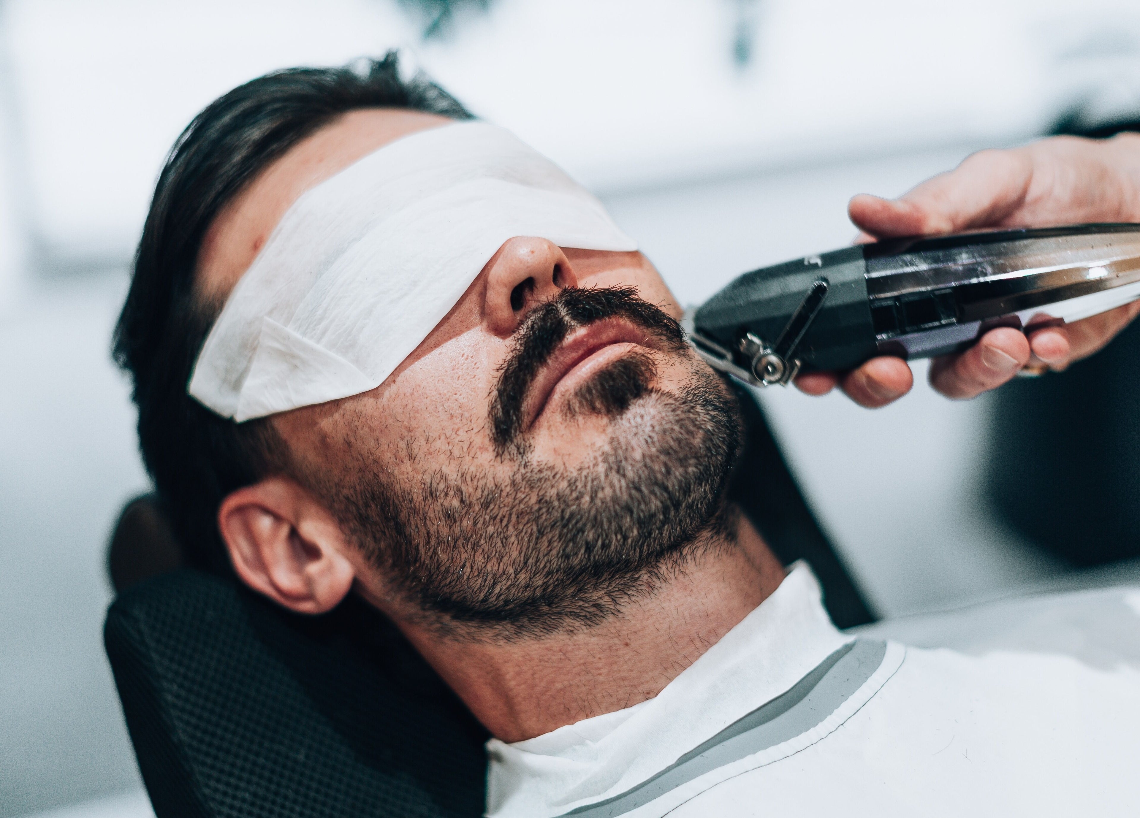 Close-up of a client receiving a beard trim at Barbieri Barbershop & SPA, Lisboa, Lisboa, PT.