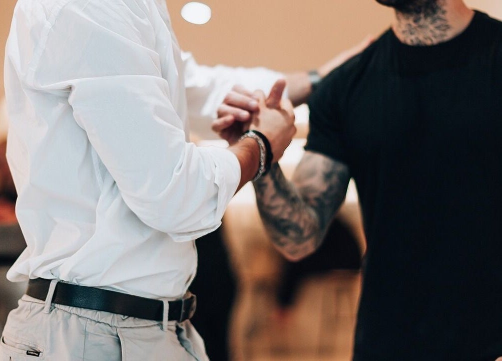 A warm handshake at Barbieri Barbershop & SPA, Lisboa, Lisboa, PT, showcasing welcoming ambiance.