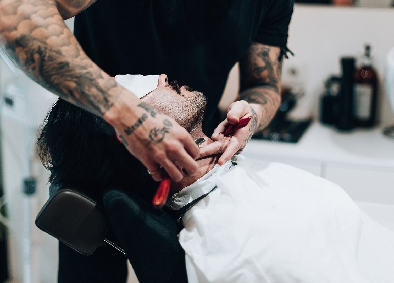 Close-up of a client receiving a shave at Barbieri Barbershop & SPA, Lisboa, Lisboa, PT.