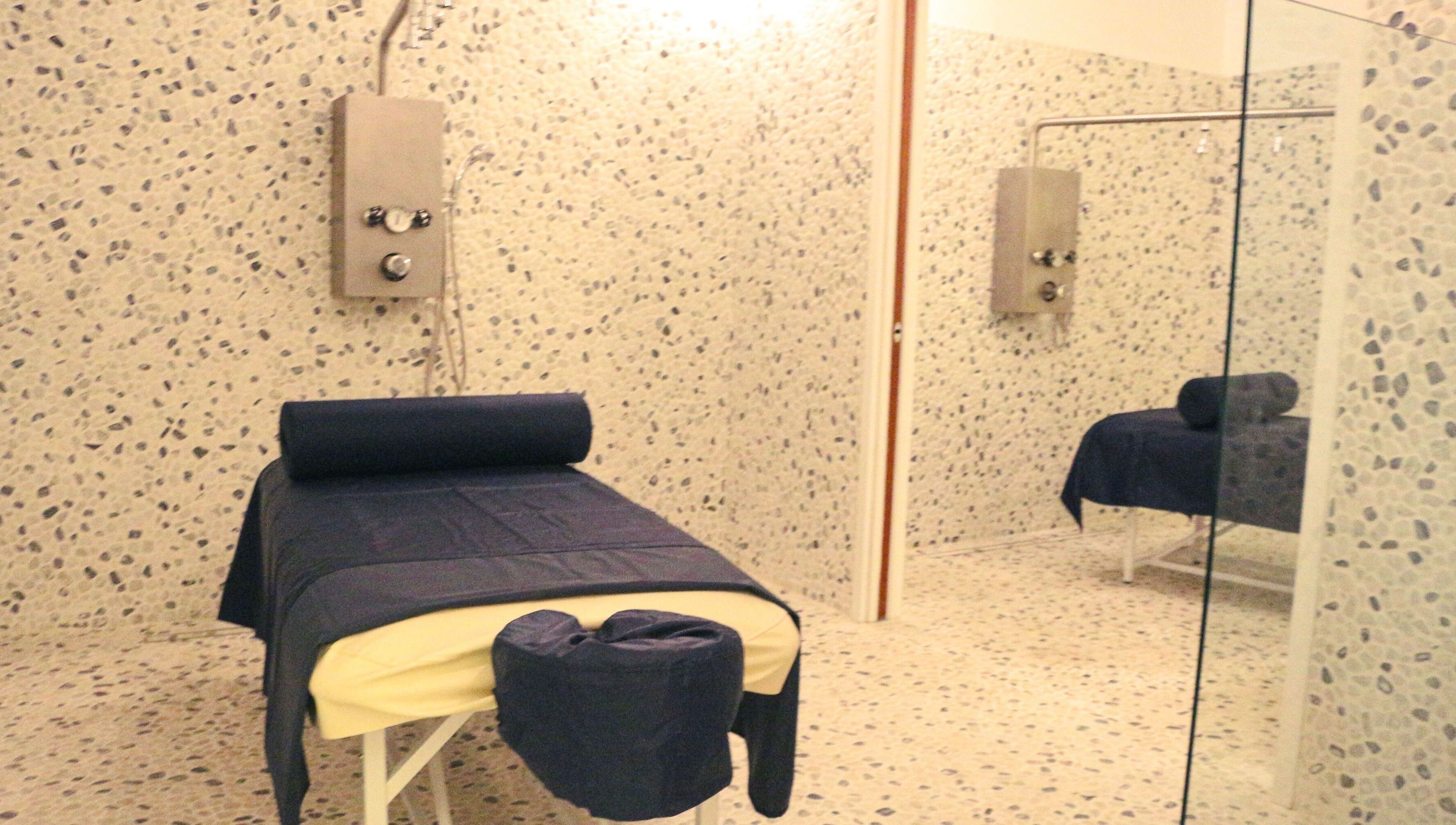 Relaxing spa room at The Lotus Center Spa, Virgin Gorda, British Virgin Islands, US with a massage table.