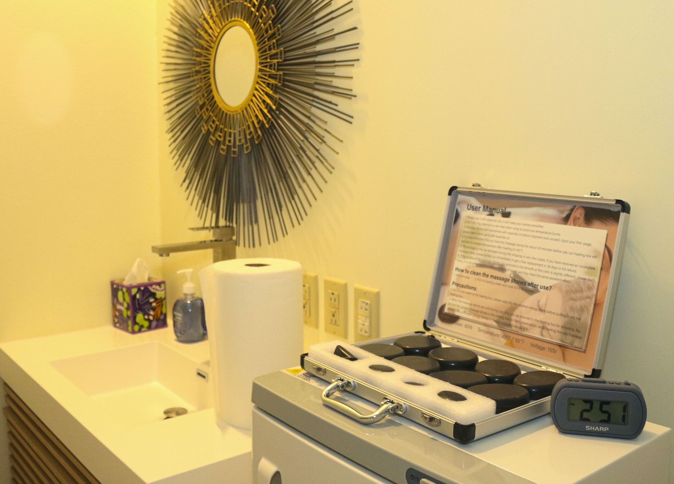 Elegant sink area at The Lotus Center Spa, Virgin Gorda, British Virgin Islands, US with massage stones.