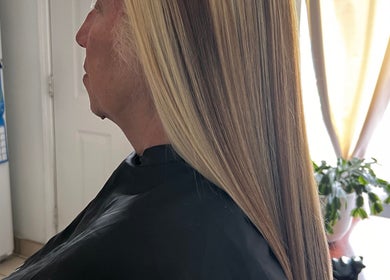 Smooth, straight blonde hair styled at Vita Bella LLC, Naugatuck, Connecticut, US.