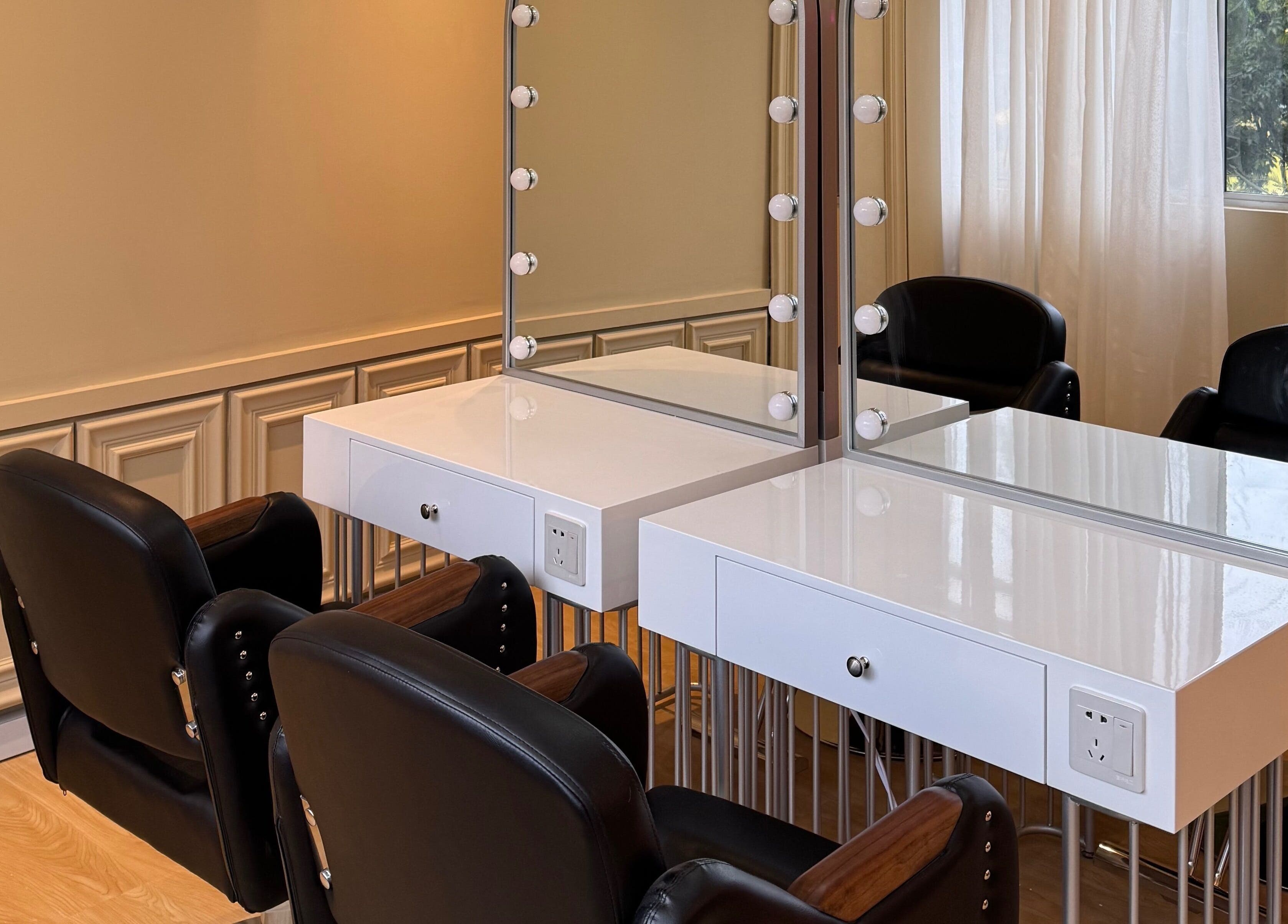 Elegant styling station at Aurora Muslimah Salon & Spa Setapak, Kuala Lumpur, MY, featuring chic mirrors and seating.