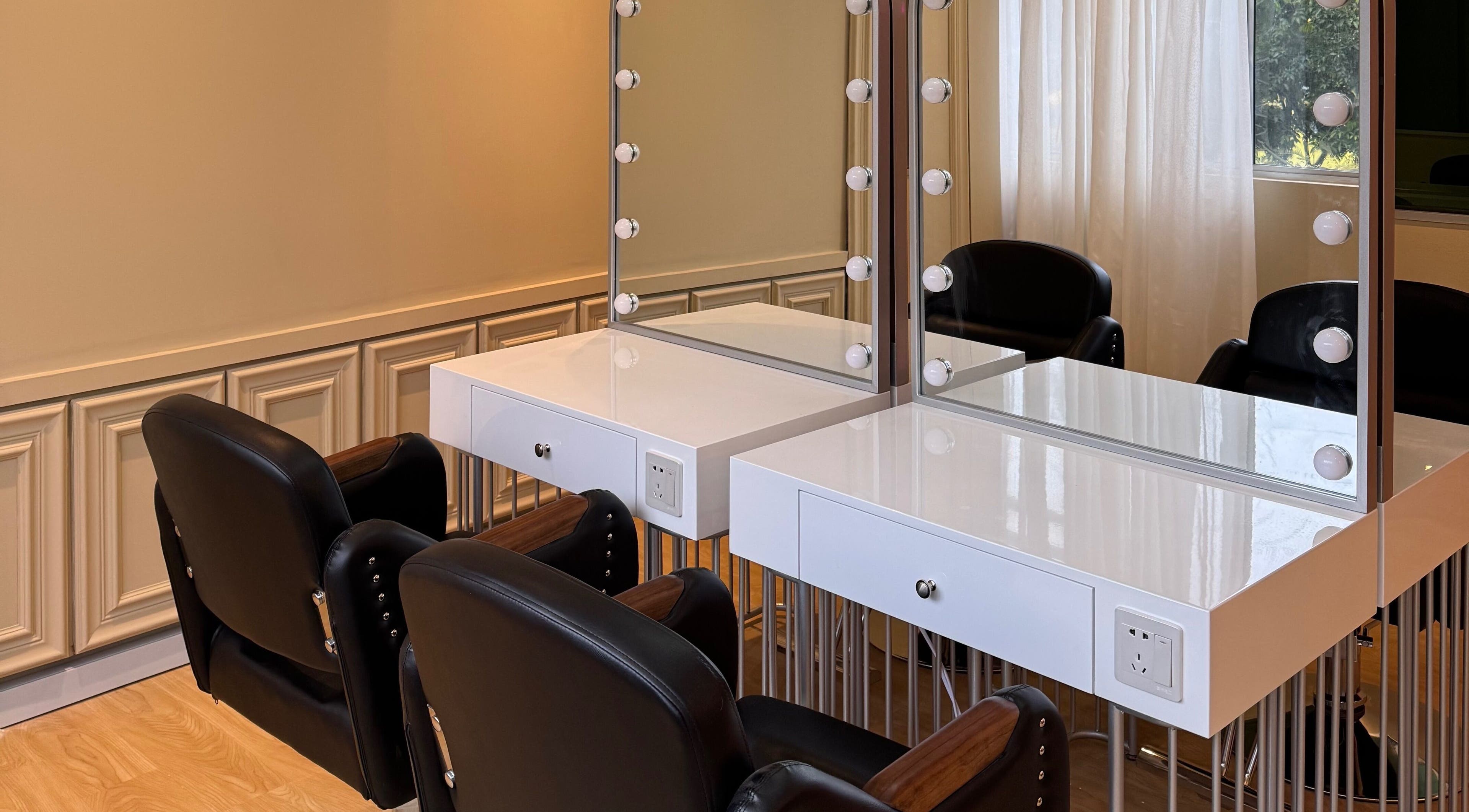 Elegant styling station at Aurora Muslimah Salon & Spa Setapak, Kuala Lumpur, MY, featuring chic mirrors and seating.