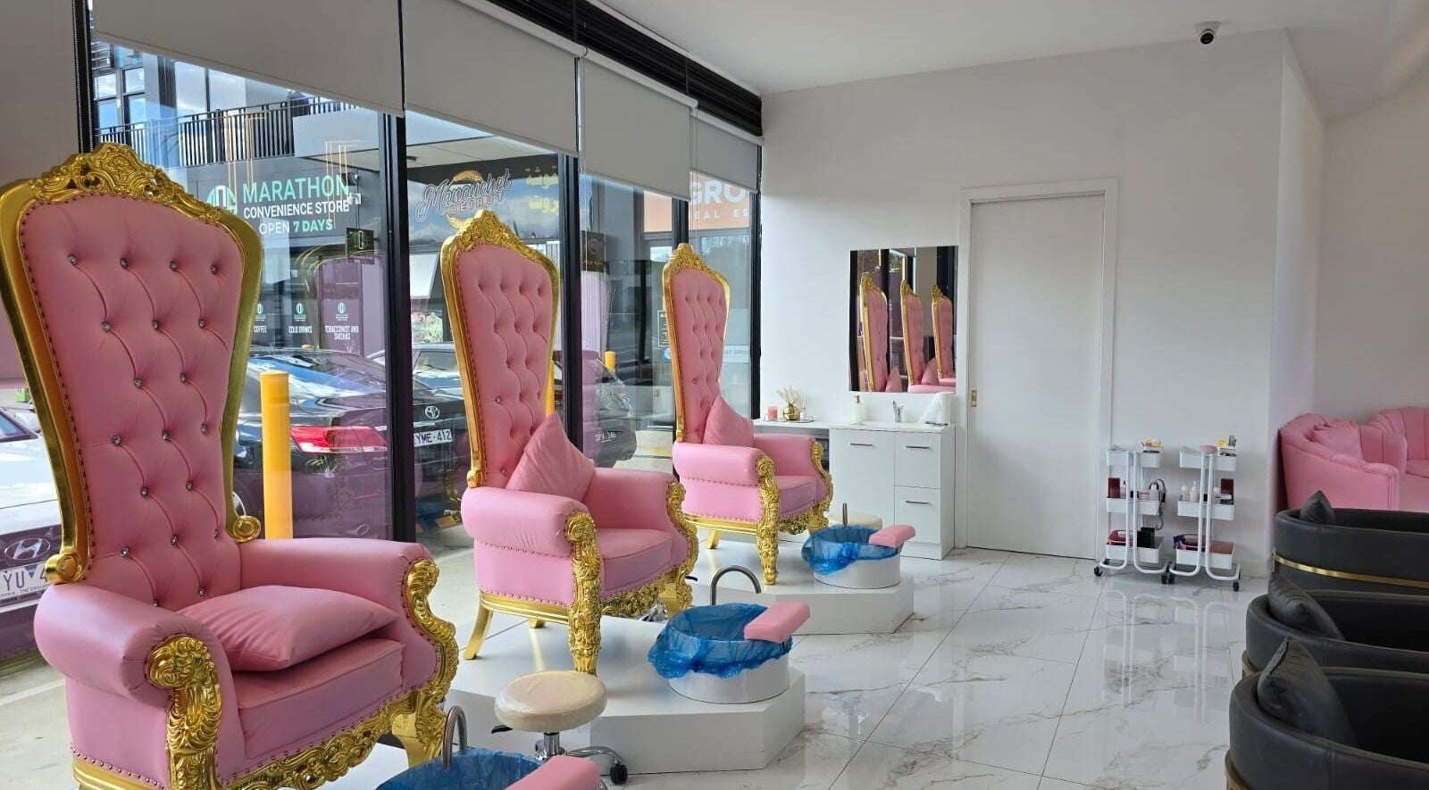 Elegant pink and gold pedicure chairs at Vr Nails in Melbourne, Victoria, AU, offering luxury nail services.