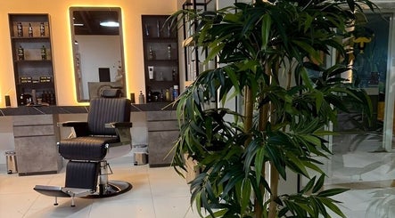 Stylish barber chair at Triple Nine Barber Gents Care Center, Abu Dhabi, AE, surrounded by modern decor.