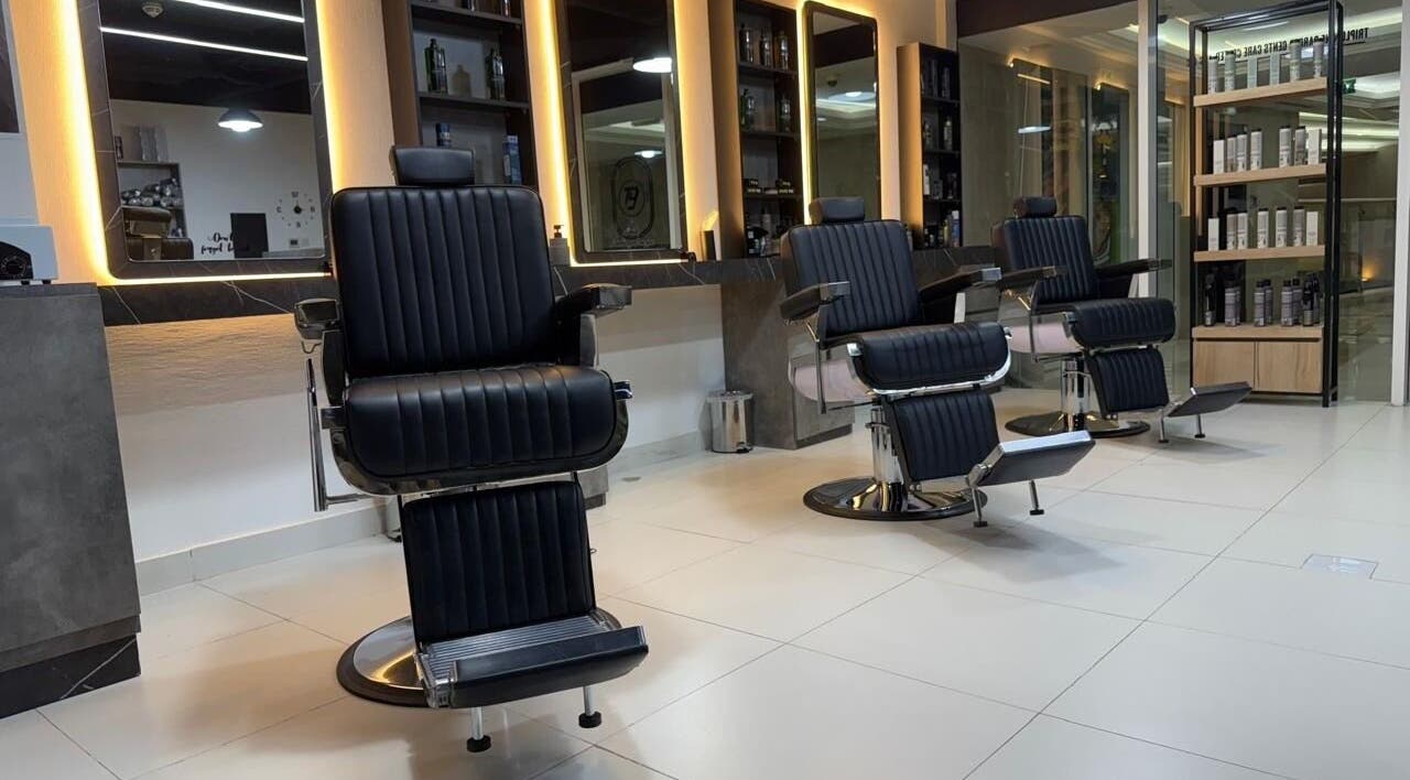 Modern barber chairs at Triple Nine Barber Gents Care Center, Abu Dhabi, Abu Dhabi, AE offering luxury grooming.