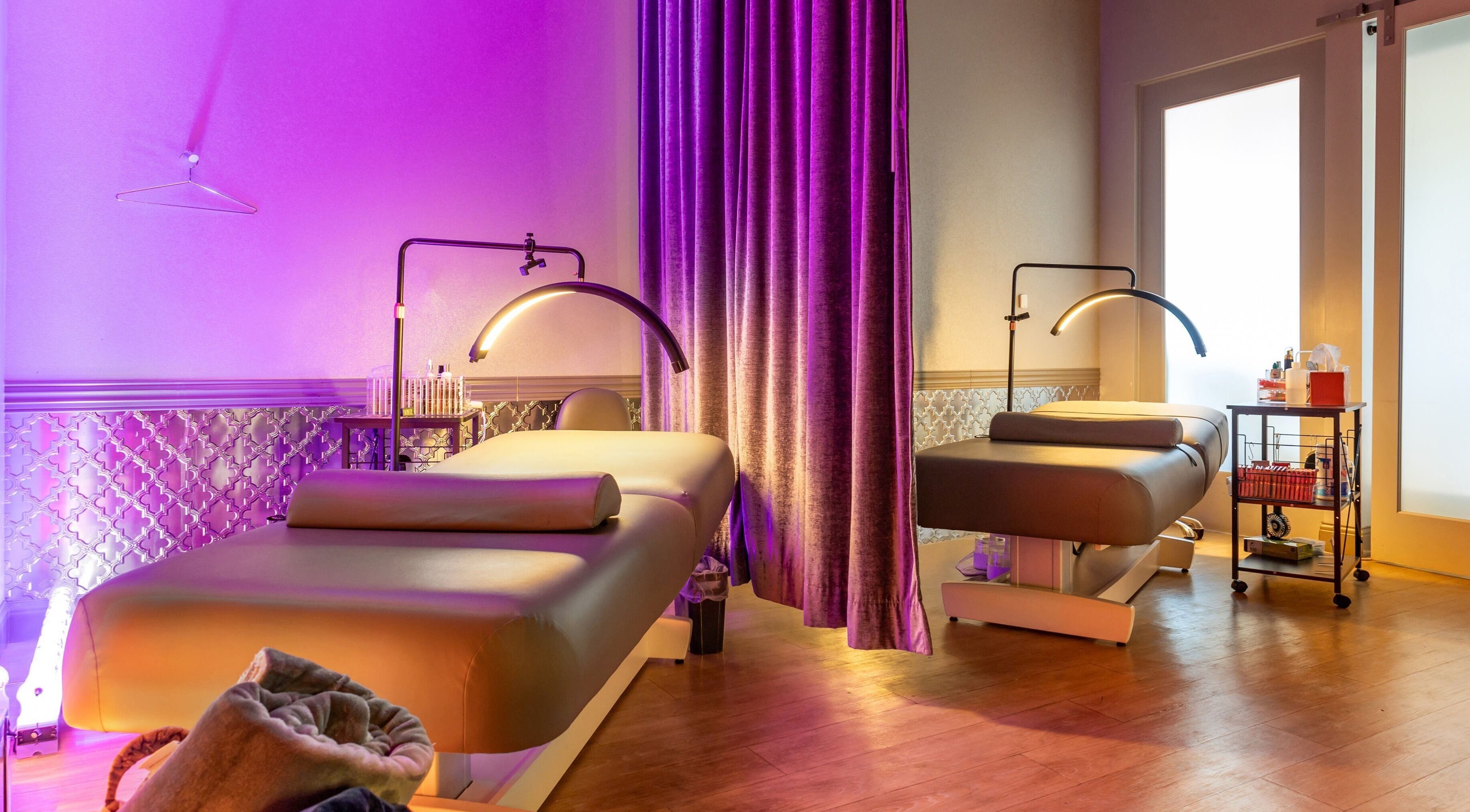 Luxurious spa room at The Lash Empire - Alamo in Alamo, California, US with ambient lighting and massage tables.
