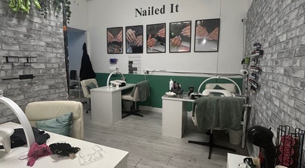 Interior of Nailed It salon in Camborne, England, GB with stylish manicure stations and wall decor.