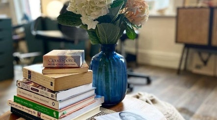 Cozy book corner at Emma-Jane Hair @ Salt & Co with a vase on a table, Dublin 2, County Dublin, IE.