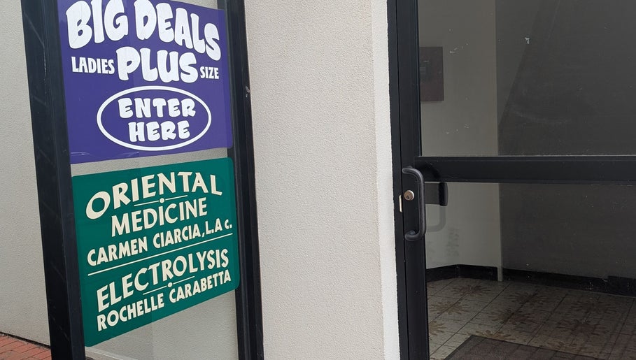 Signage at Crystal Pavis, LMT's entrance in Cromwell, Connecticut, US; oriental medicine and electrolysis.