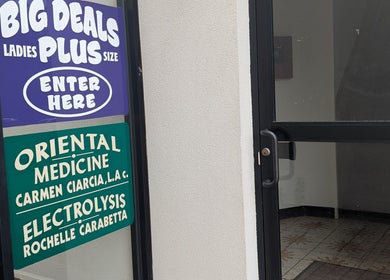 Signage at Crystal Pavis, LMT's entrance in Cromwell, Connecticut, US; oriental medicine and electrolysis.