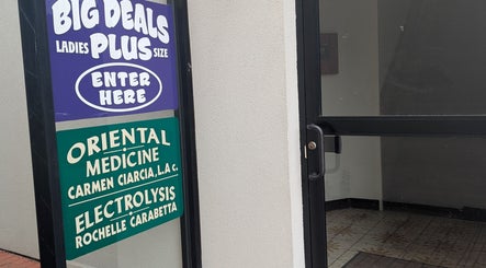 Signage at Crystal Pavis, LMT's entrance in Cromwell, Connecticut, US; oriental medicine and electrolysis.