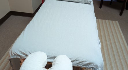 Massage table at Crystal Pavis, LMT in Cromwell, Connecticut, US, prepared for a relaxing session.