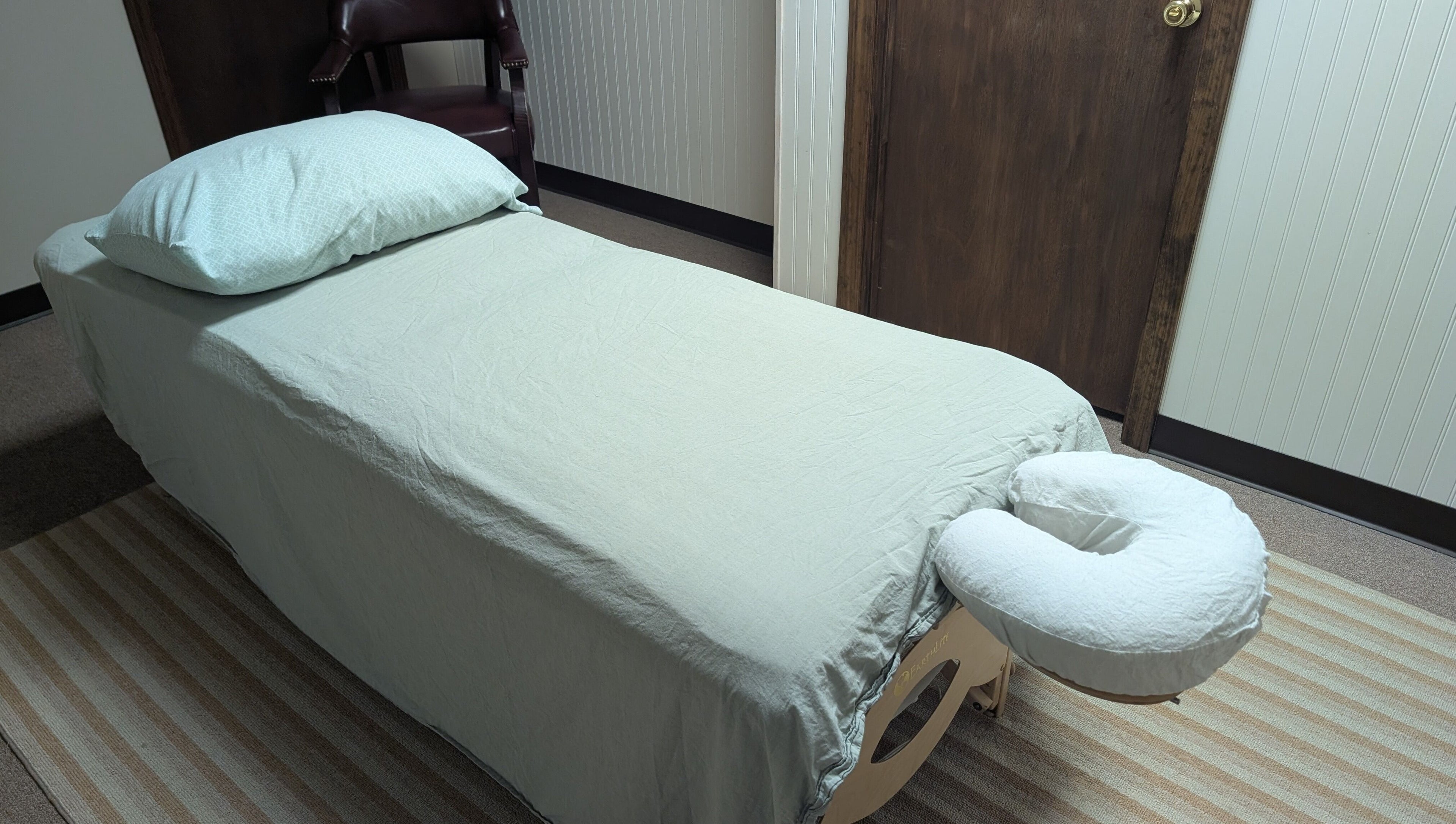 Massage table setup at Crystal Pavis, LMT, Cromwell, Connecticut, US, highlighting relaxation ambiance.