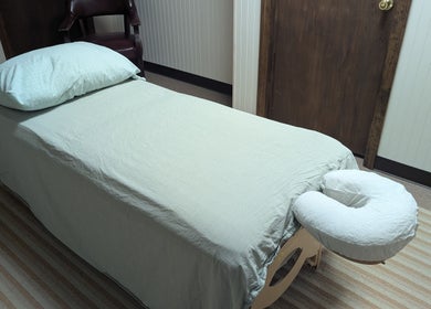 Massage table setup at Crystal Pavis, LMT, Cromwell, Connecticut, US, highlighting relaxation ambiance.