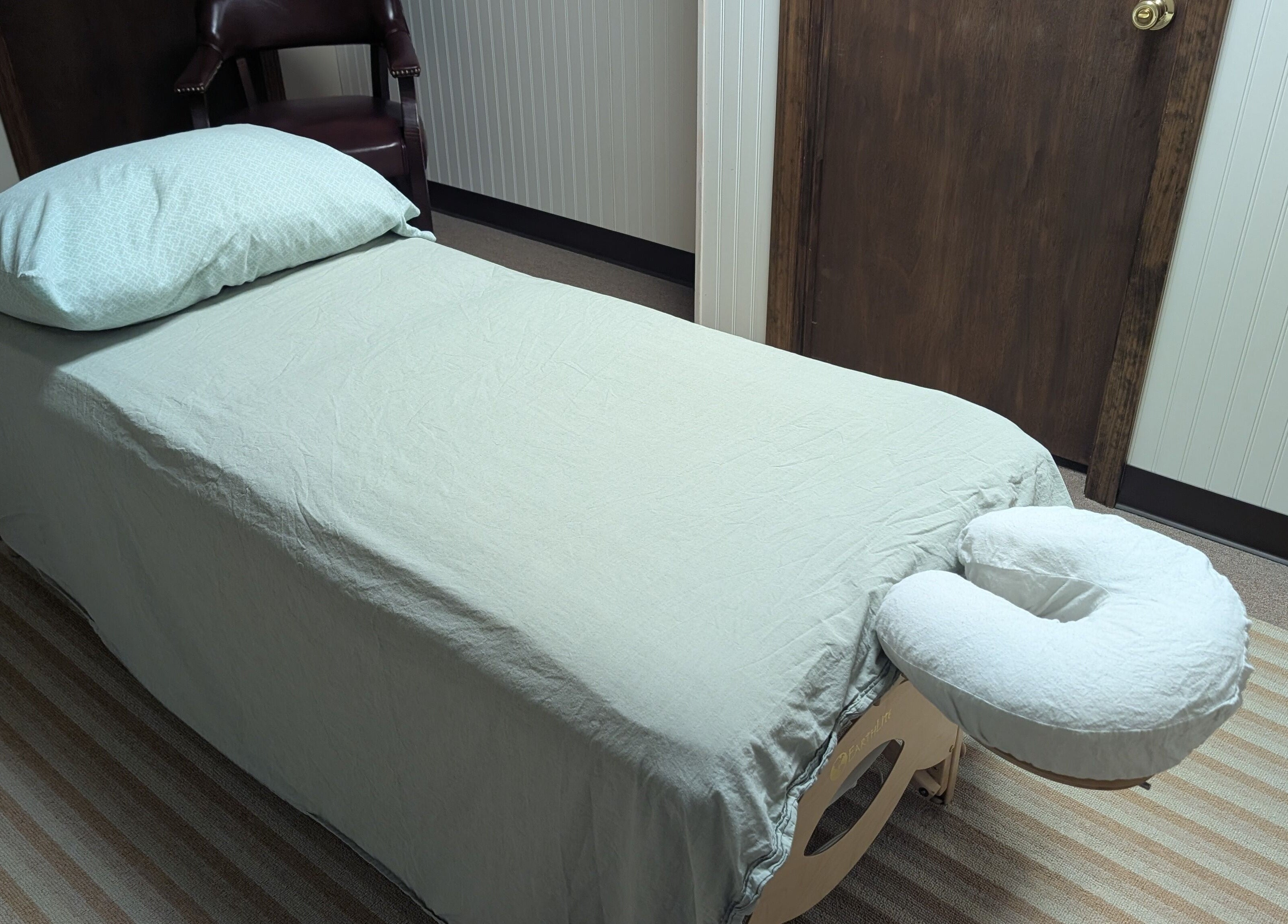 Massage table setup at Crystal Pavis, LMT, Cromwell, Connecticut, US, highlighting relaxation ambiance.