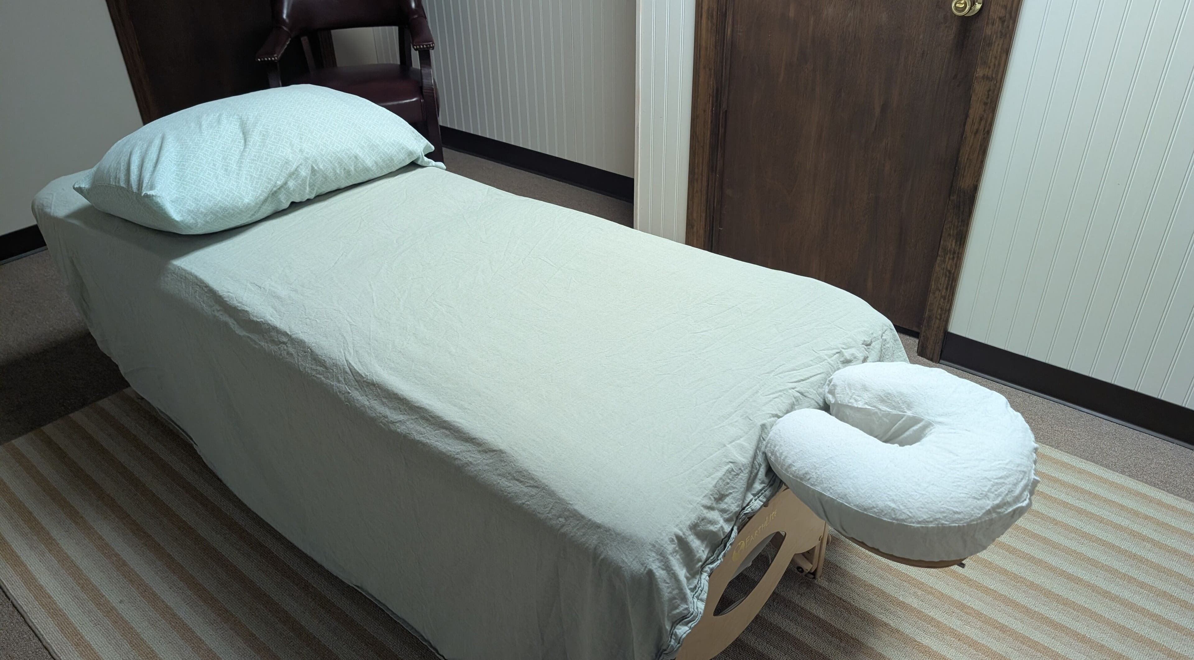 Massage table setup at Crystal Pavis, LMT, Cromwell, Connecticut, US, highlighting relaxation ambiance.