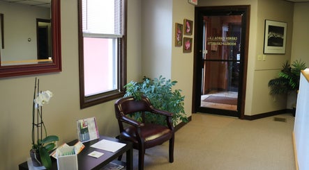 Inviting lobby at Crystal Pavis, LMT in Cromwell, Connecticut, US with plants and comfortable seating.