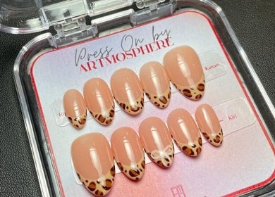 Leopard print nails at Nails by Artmosphere Pop Up, Jawa Barat, ID. Trendy nail art in a sleek display case.