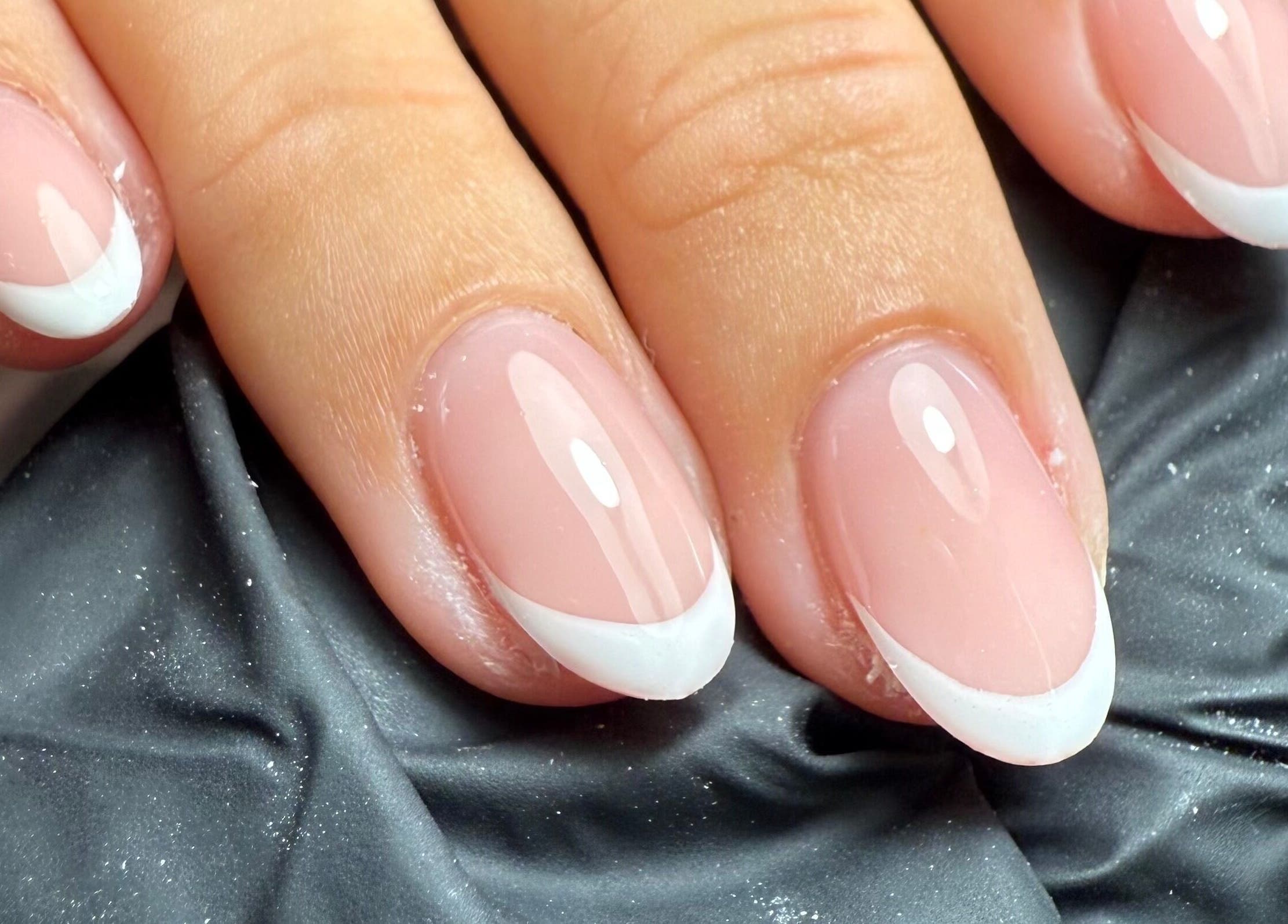 Elegant French manicure at Sofs Beauty Bar, Dowlais, Cymru, GB showcasing sleek nail design.