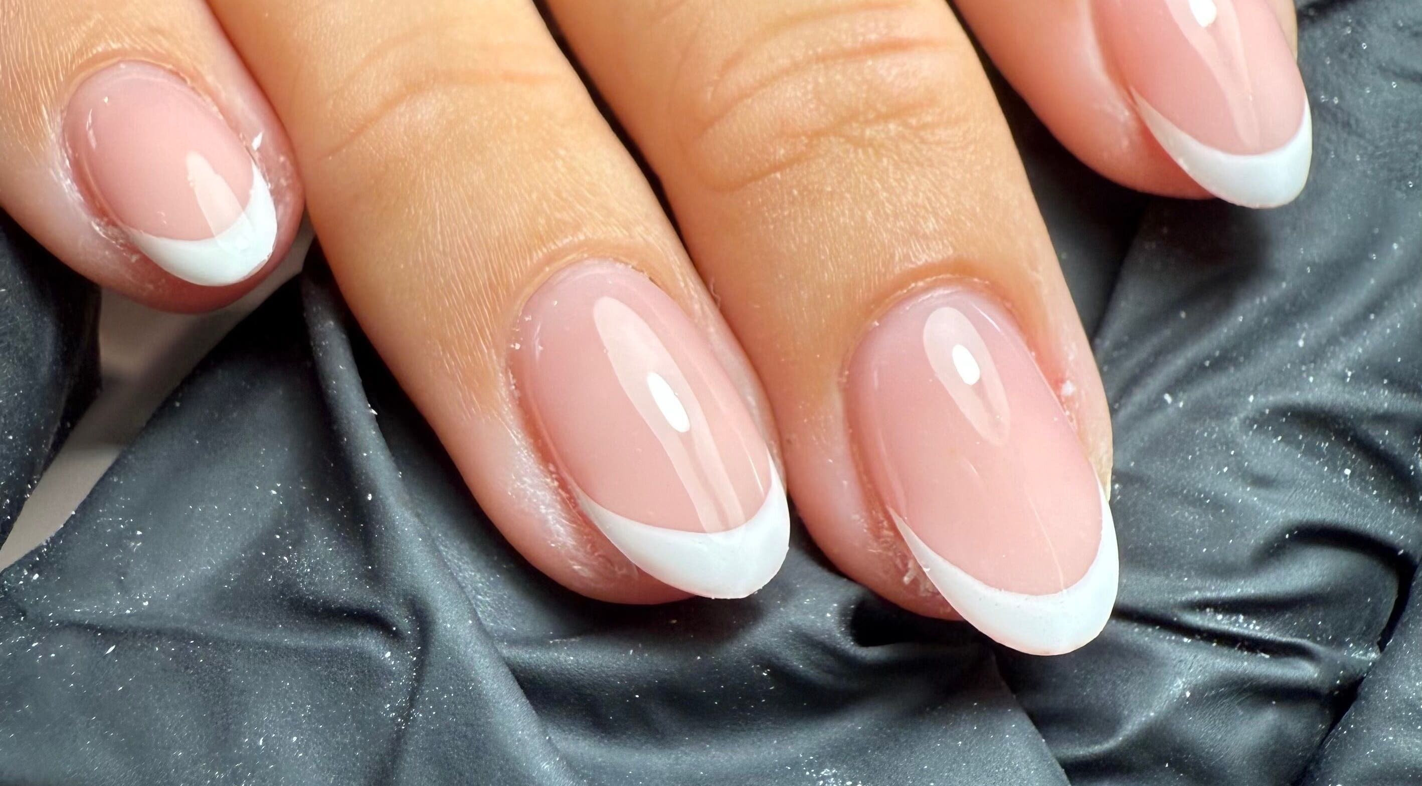 Elegant French manicure at Sofs Beauty Bar, Dowlais, Cymru, GB showcasing sleek nail design.