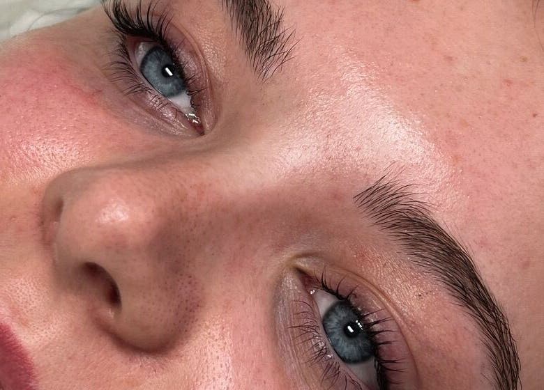 Close-up of a fresh-faced woman at PS Beauty Bar, Hereford, England, GB after a skincare treatment.