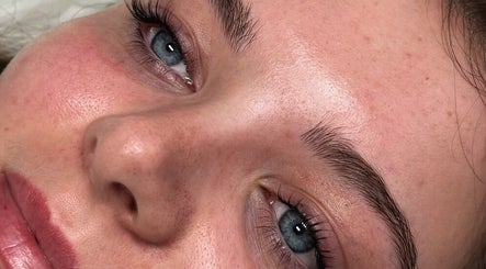 Close-up of a fresh-faced woman at PS Beauty Bar, Hereford, England, GB after a skincare treatment.