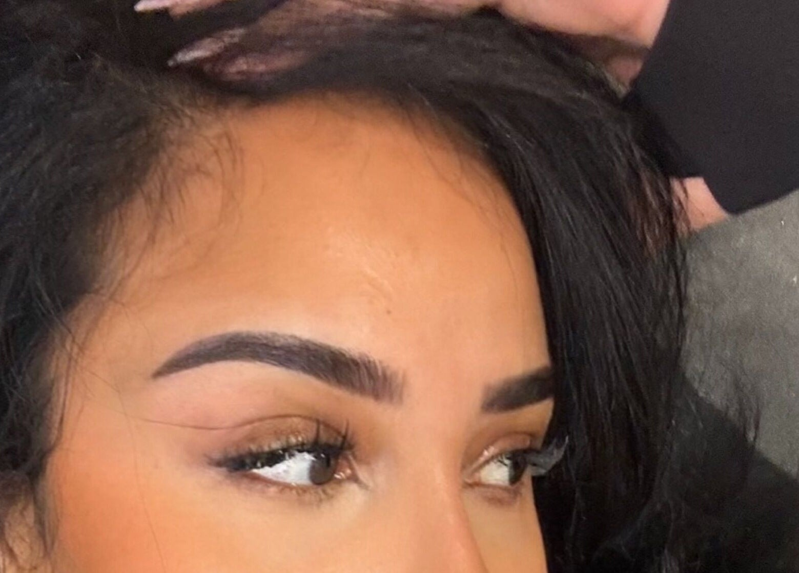 Expertly shaped eyebrows at Brows_byTam, London, England, GB showcasing precise beauty techniques.