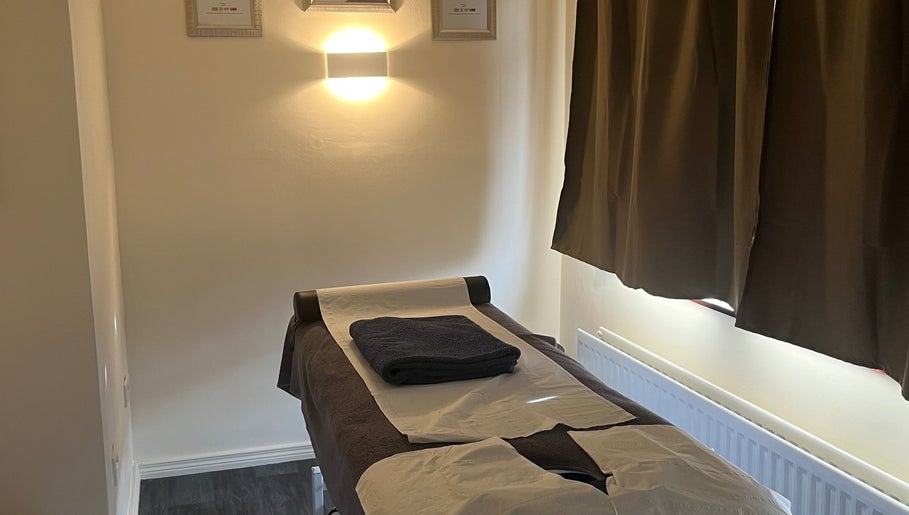 Massage table in tranquil room at Muscle Alchemy Massage, Glengormley, Northern Ireland, GB.