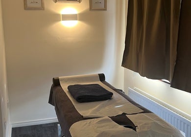 Massage table in tranquil room at Muscle Alchemy Massage, Glengormley, Northern Ireland, GB.