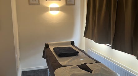 Massage table in tranquil room at Muscle Alchemy Massage, Glengormley, Northern Ireland, GB.