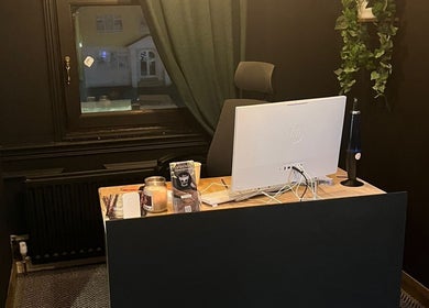 Reception desk at Muscle Alchemy Massage, Glengormley, Northern Ireland, GB, featuring a computer setup.