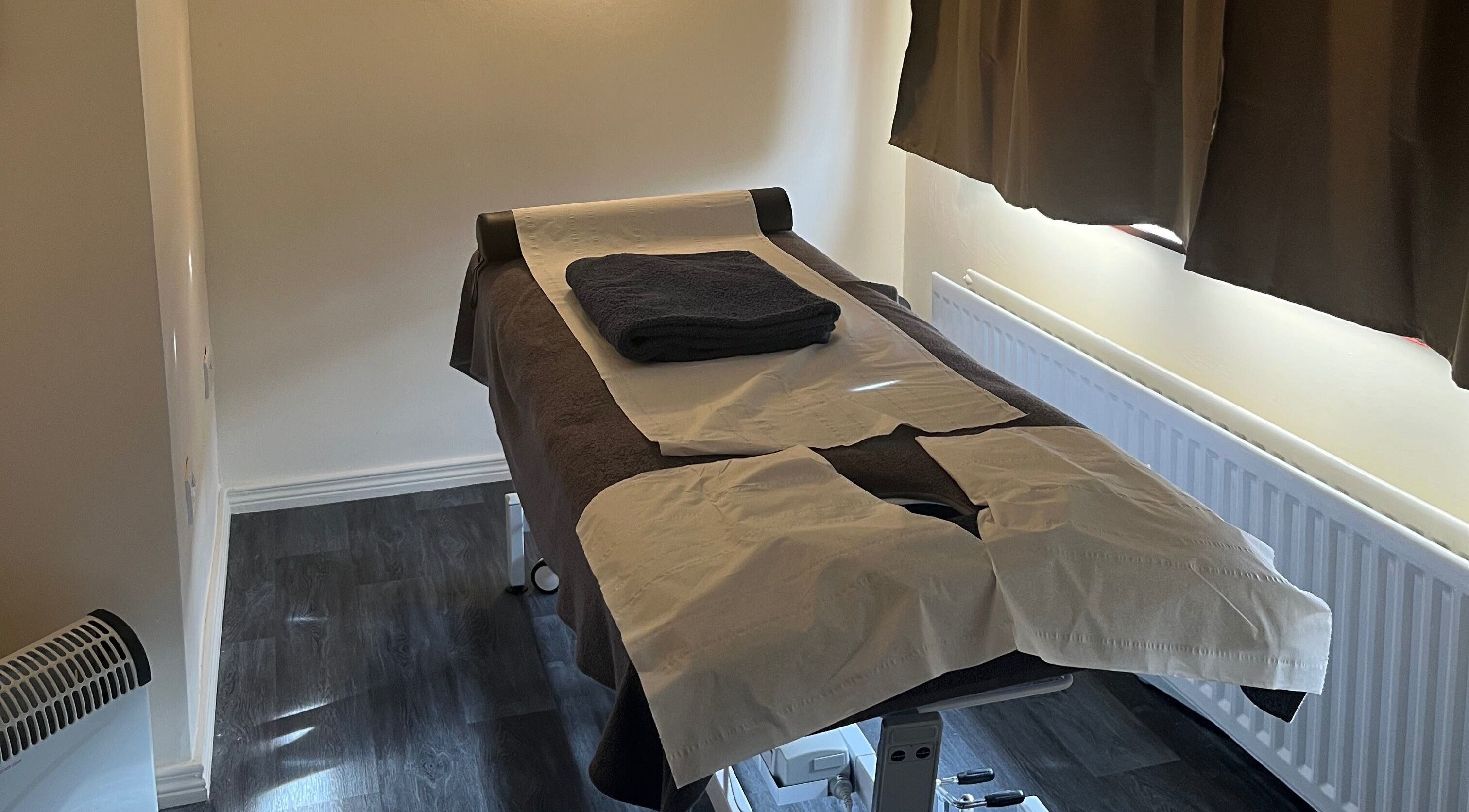 Cozy massage room at Muscle Alchemy Massage, Glengormley, Northern Ireland, GB, with prepared massage table.