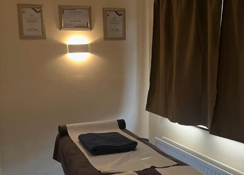 Cozy massage room at Muscle Alchemy Massage, Glengormley, Northern Ireland, GB, inviting relaxation and comfort.