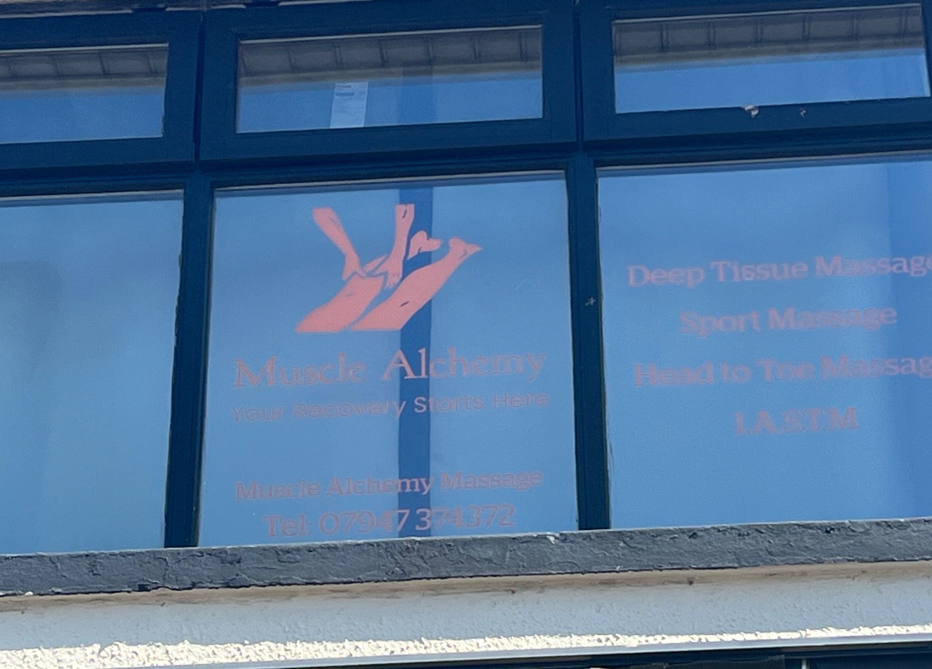 Exterior window of Muscle Alchemy Massage in Glengormley, Northern Ireland, GB, displaying massage services.