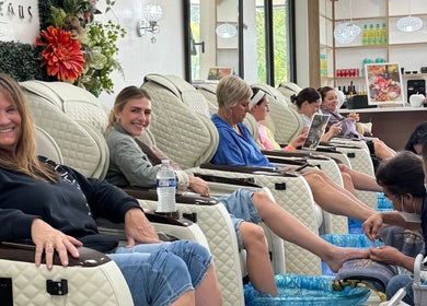 Guests enjoy relaxing pedicures at Four Seasons Nails and Spa Sherwood, Oregon, US, in a serene setting.