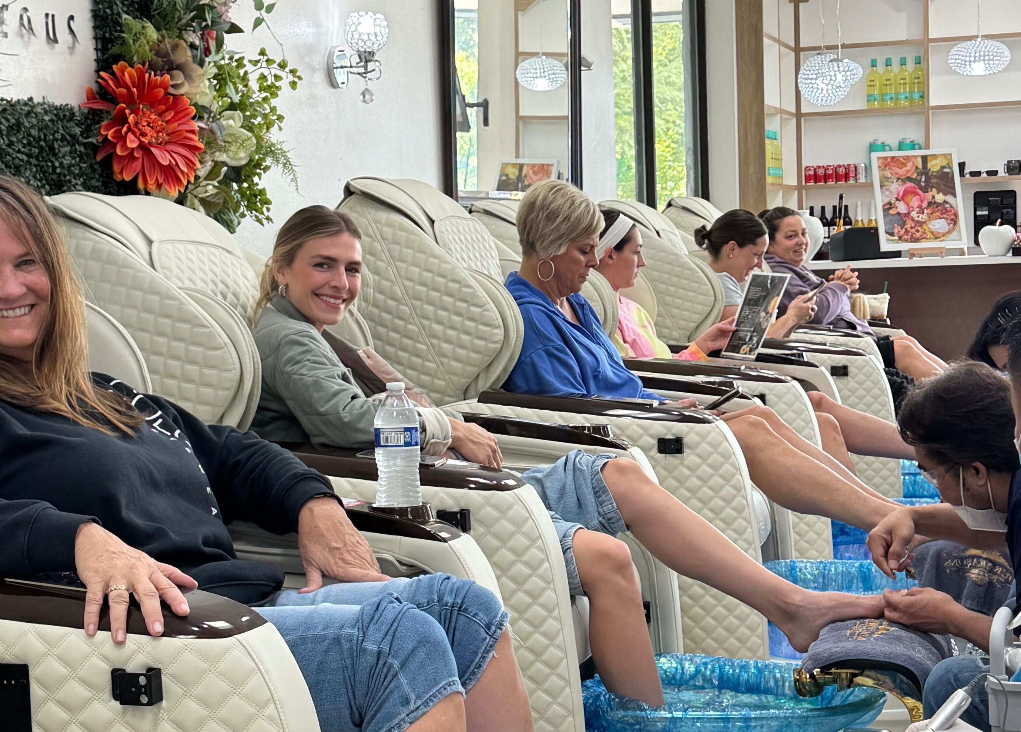 Guests enjoy relaxing pedicures at Four Seasons Nails and Spa Sherwood, Oregon, US, in a serene setting.