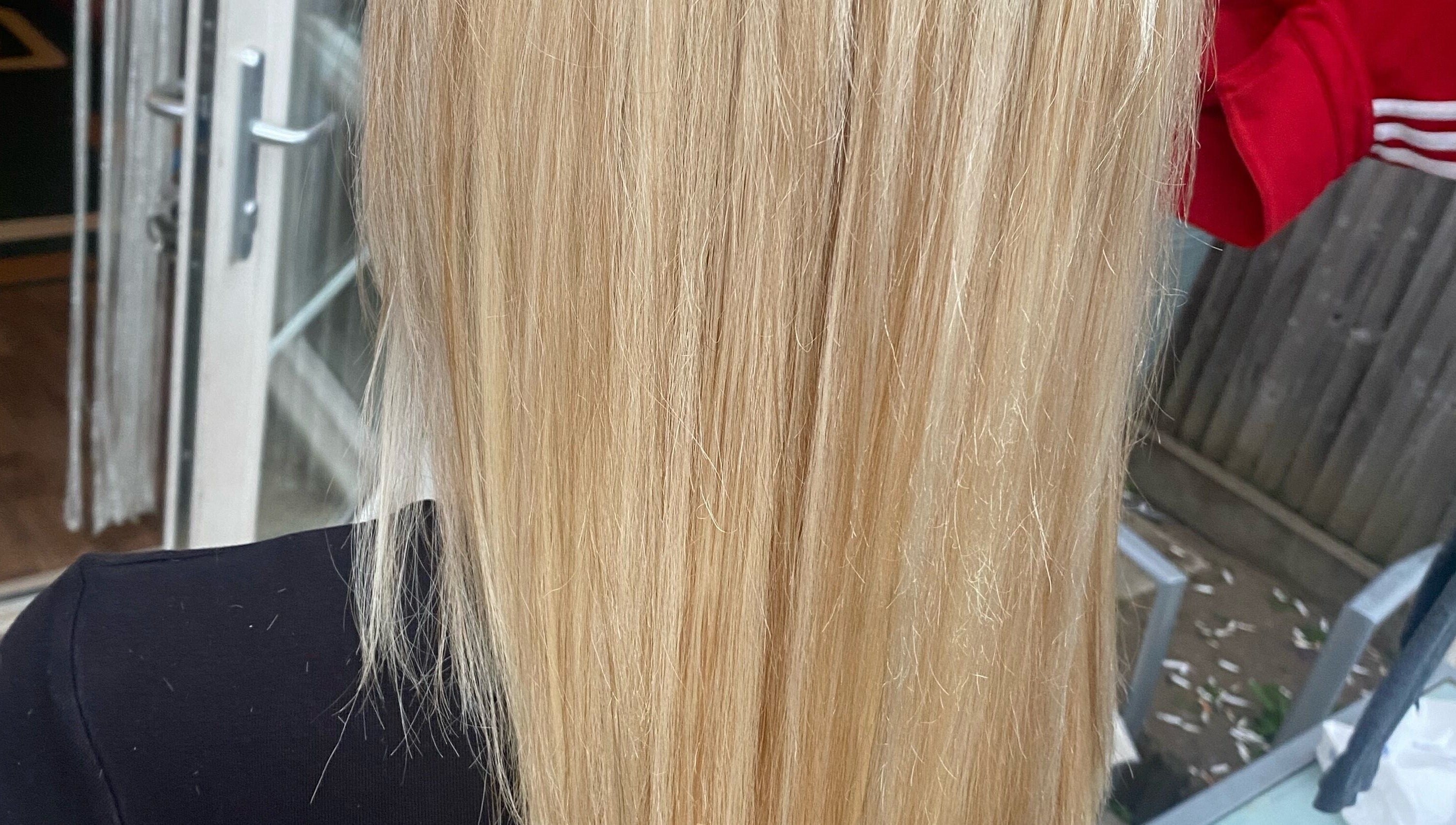 Close-up of silky blonde hair treatment at Bendall Beauty in Farnborough, England, GB.