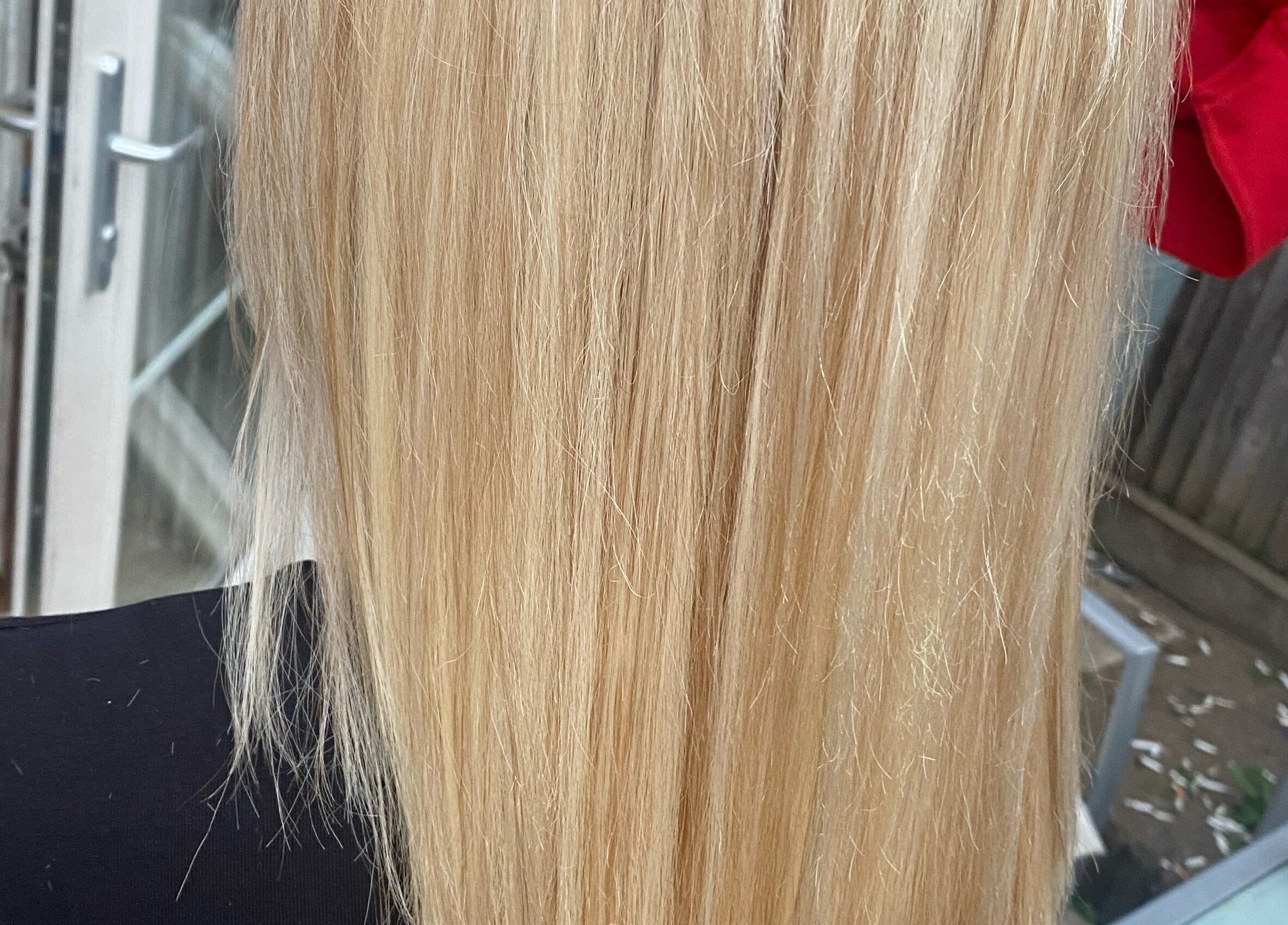 Close-up of silky blonde hair treatment at Bendall Beauty in Farnborough, England, GB.