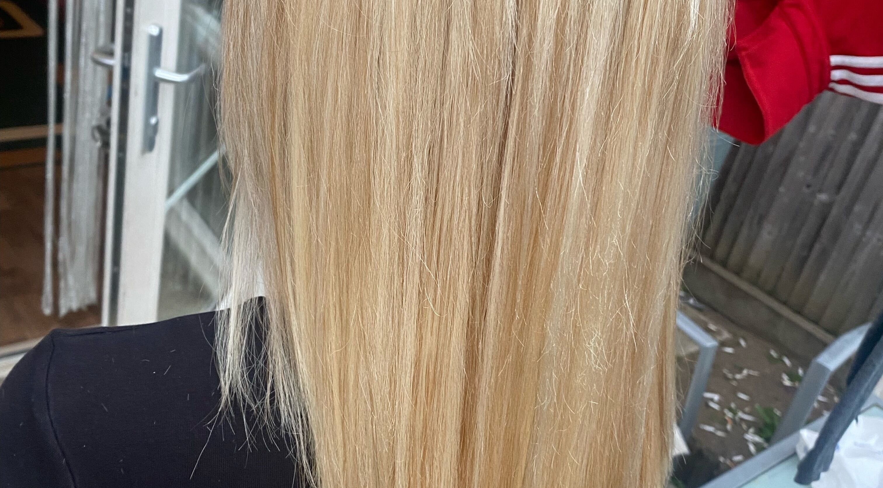 Close-up of silky blonde hair treatment at Bendall Beauty in Farnborough, England, GB.