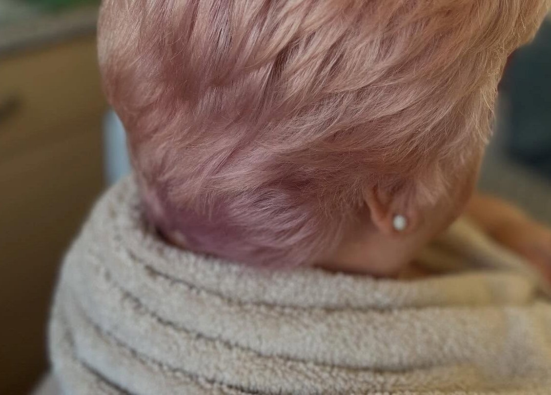 Trendy blush-colored hairstyle at Bendall Beauty, Farnborough, England, GB. Perfect for a chic look.