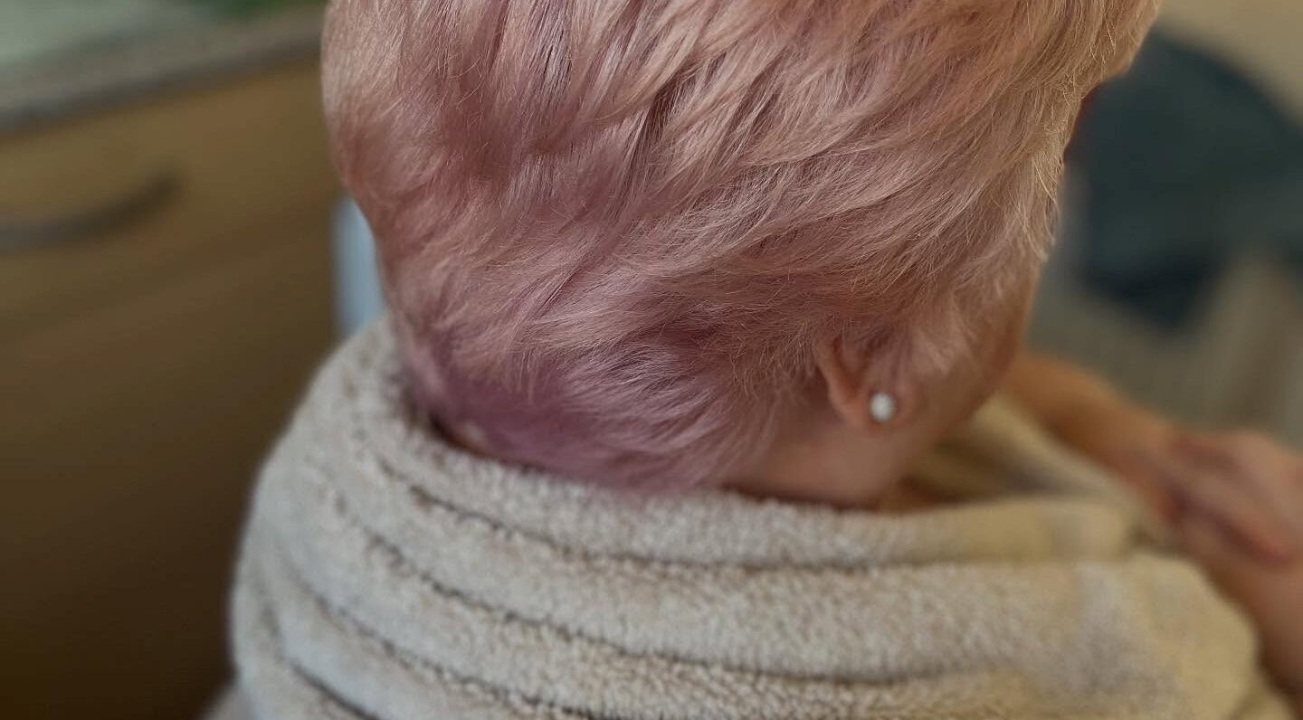 Trendy blush-colored hairstyle at Bendall Beauty, Farnborough, England, GB. Perfect for a chic look.