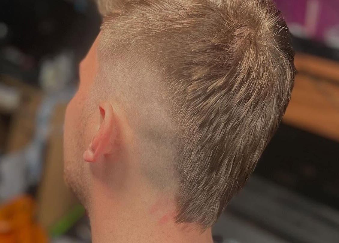 Trendy men's haircut at Bendall Beauty in Farnborough, England, GB offers sleek style and fresh look.