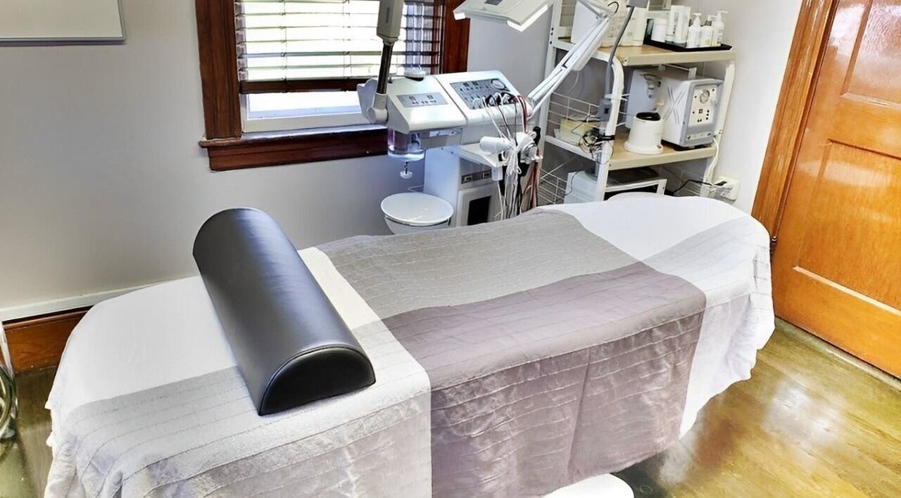 Calm treatment room at Skin Deep Skin in Quincy, Massachusetts, US, showcasing a comfortable spa bed.