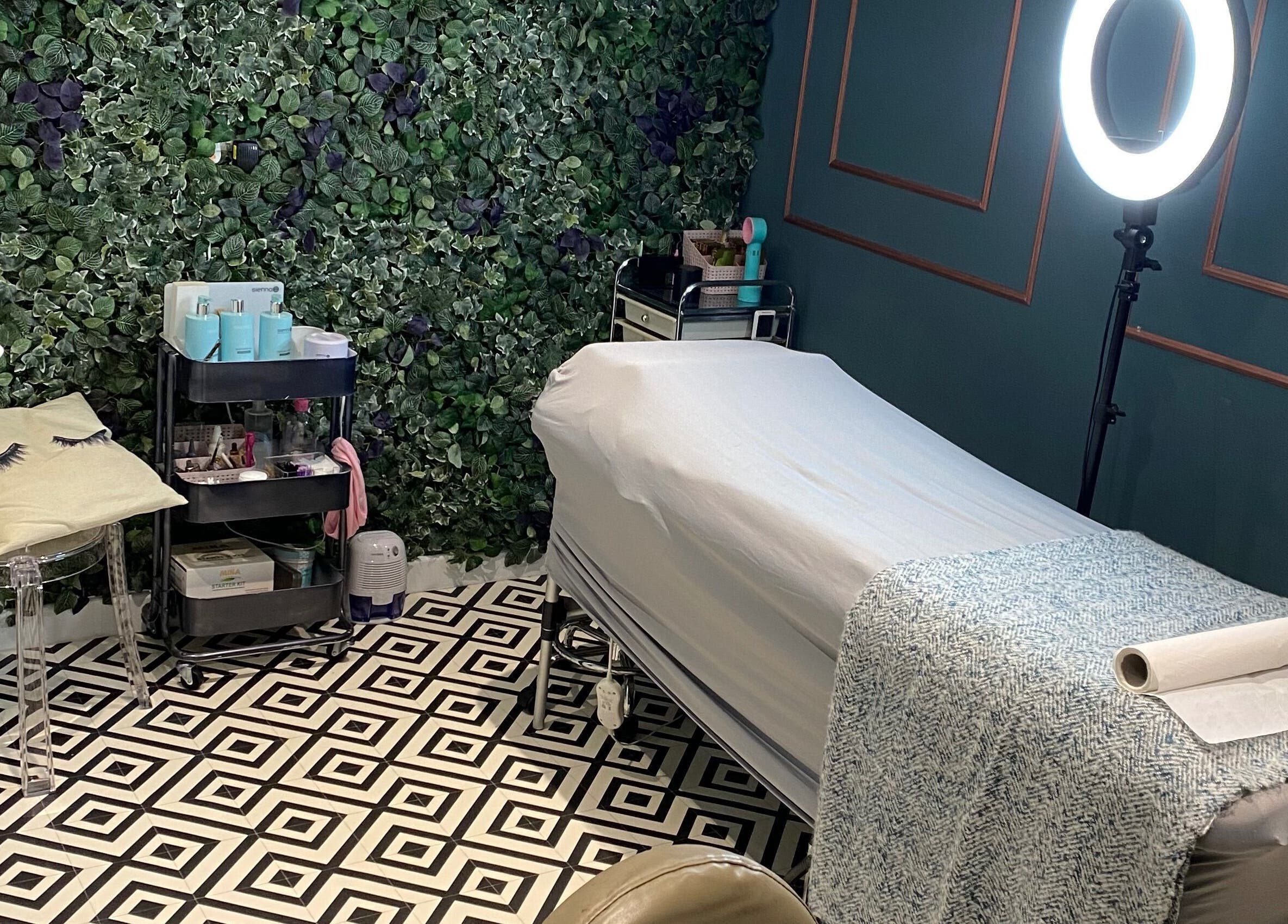 Relaxing treatment room at 86 Sassy Hair and Beauty, Newcastle upon Tyne, England, GB, with a chic design and foliage decor.