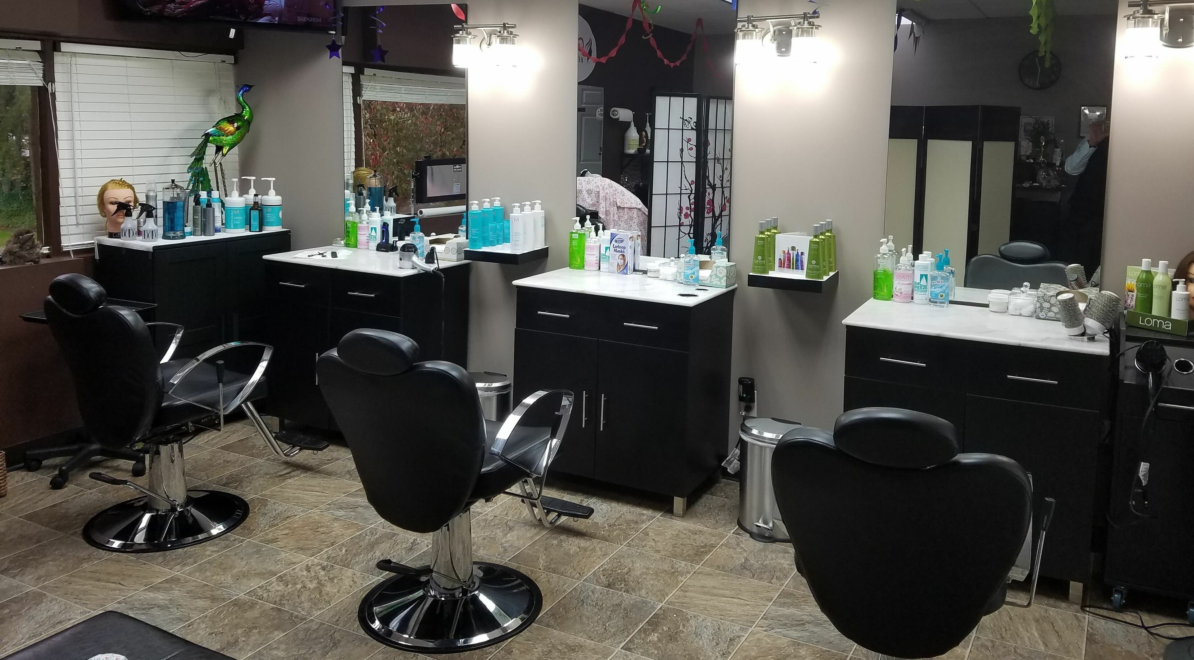 Interior of Galaxy Beauty Salon in Bellevue, Washington, US, showcasing stylish chairs and beauty products.